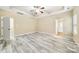 Spacious main bedroom with tray ceilings, ceiling fan, and luxury vinyl plank flooring at 119 Front Porch Dr # 46, Rock Hill, SC 29732