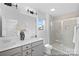 Modern bathroom featuring double sinks, a glass-enclosed shower, and stylish fixtures at 119 Stonewater Dr # 22, Red Cross, NC 28129