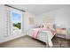 Bright bedroom featuring a comfortable bed, colorful decor, and a window with a scenic view at 119 Stonewater Dr # 22, Red Cross, NC 28129