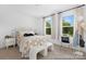 Inviting bedroom with a cozy bed, stylish decor, and plenty of natural light at 119 Stonewater Dr # 22, Red Cross, NC 28129