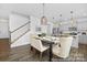 Open dining area next to kitchen features hardwood floors, and stylish decor at 119 Stonewater Dr # 22, Red Cross, NC 28129
