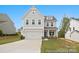 Charming two-story home featuring a symmetrical facade, attached two-car garage, and manicured lawn at 119 Stonewater Dr # 22, Red Cross, NC 28129