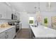Bright, modern kitchen with quartz countertops, stainless appliances, and grey cabinets at 119 Stonewater Dr # 22, Red Cross, NC 28129