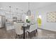 Modern kitchen with stainless steel appliances, central island with seating, and adjacent dining area at 119 Stonewater Dr # 22, Red Cross, NC 28129