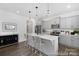 Modern kitchen featuring a central island with seating, stainless steel appliances, and stylish pendant lighting at 119 Stonewater Dr # 22, Red Cross, NC 28129