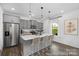 Modern kitchen featuring a central island with seating, stainless steel appliances, and stylish pendant lighting at 119 Stonewater Dr # 22, Red Cross, NC 28129