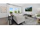 Bright and spacious living room featuring hardwood floors, large windows, and modern decor at 119 Stonewater Dr # 22, Red Cross, NC 28129