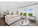 Open-concept living space with hardwood floors, comfortable seating, and seamless flow to the kitchen at 119 Stonewater Dr # 22, Red Cross, NC 28129