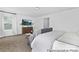 Comfortable main bedroom featuring large windows and contemporary decor at 119 Stonewater Dr # 22, Red Cross, NC 28129