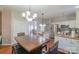 Open-concept dining area adjacent to a well-equipped kitchen with an island at 12112 Autumn Winds Ln, Pineville, NC 28134