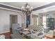 Formal dining room featuring chandelier, glass table, and stylish patterned chairs at 12112 Autumn Winds Ln, Pineville, NC 28134