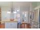 Kitchen island with a granite countertop and stainless steel appliances nearby at 12112 Autumn Winds Ln, Pineville, NC 28134