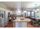 Bright kitchen with stainless steel appliances and an open layout to the dining area at 12112 Autumn Winds Ln, Pineville, NC 28134