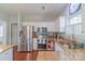 Bright kitchen with white cabinets, granite countertops, and stainless steel appliances at 12112 Autumn Winds Ln, Pineville, NC 28134