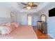 Comfortable main bedroom featuring hardwood floors and neutral colors at 12112 Autumn Winds Ln, Pineville, NC 28134