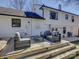 Back deck with outdoor seating, a grill, and stairs leading to the yard at 1225 Braeburn Rd, Charlotte, NC 28211
