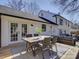 Back deck featuring outdoor furniture, a dining table, and French doors leading into the home at 1225 Braeburn Rd, Charlotte, NC 28211