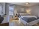 Bedroom featuring a queen bed, nightstands with lamps, and a large window for natural light at 1225 Braeburn Rd, Charlotte, NC 28211