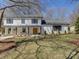 Inviting two-story home featuring a covered porch, landscaped yard, and neutral exterior paint at 1225 Braeburn Rd, Charlotte, NC 28211