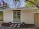 Charming building with double doors, a neutral facade and mature landscaping at 1225 Braeburn Rd, Charlotte, NC 28211