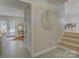 Bright hallway with decorative flooring, leading to the dining area and living room at 1225 Braeburn Rd, Charlotte, NC 28211