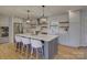 Stylish kitchen featuring a large island with seating, stainless steel appliances and modern decor at 1225 Braeburn Rd, Charlotte, NC 28211