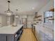 Modern kitchen featuring a large island with seating, stainless steel appliances, and bright open layout at 1225 Braeburn Rd, Charlotte, NC 28211