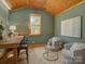 Comfortable living area with wood floors, chairs, a desk, and a window with lots of light at 1225 Braeburn Rd, Charlotte, NC 28211