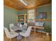 Inviting living area featuring wood floors, a dining area and a window with natural light at 1225 Braeburn Rd, Charlotte, NC 28211