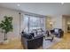 Bright living room showcasing hardwood floors, recessed lights, comfortable seating and stylish decor at 1225 Braeburn Rd, Charlotte, NC 28211