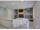 Living room featuring a fireplace, built-in shelving, and ample seating at 1225 Braeburn Rd, Charlotte, NC 28211