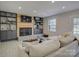 Comfortable living room featuring a fireplace, built-in shelving, and ample seating at 1225 Braeburn Rd, Charlotte, NC 28211