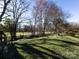 Large backyard with a wooden fence and a lush green lawn at 13807 Queenswater Ln, Charlotte, NC 28273