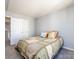 Neutral bedroom featuring a cozy bed and a closet with sliding doors at 13807 Queenswater Ln, Charlotte, NC 28273