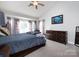 Comfortable bedroom with vaulted ceiling, neutral carpet, and ample natural light at 13807 Queenswater Ln, Charlotte, NC 28273