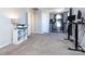 Bonus room featuring a shelf and a printer on a white shelf, as well as two desks at 13807 Queenswater Ln, Charlotte, NC 28273