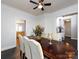This dining room showcases the dark wood flooring, and access to the kitchen and adjacent living spaces at 13807 Queenswater Ln, Charlotte, NC 28273