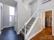 Entryway features stairs, tile flooring, and view of stainless steel refrigerator at 13807 Queenswater Ln, Charlotte, NC 28273