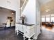 Inviting foyer with high ceilings, dark floors, staircase, and entry to the living and dining rooms at 13807 Queenswater Ln, Charlotte, NC 28273