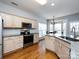 Bright kitchen with stainless steel appliances, granite countertops and breakfast nook at 13807 Queenswater Ln, Charlotte, NC 28273