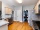 View of kitchen, with modern stainless appliances and view through into dining area at 13807 Queenswater Ln, Charlotte, NC 28273