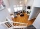 Aerial view of the living room, showing the fireplace, high windows, and open layout of the home at 13807 Queenswater Ln, Charlotte, NC 28273