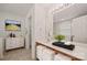 Bright bathroom featuring double vanity, decorative mirror, and white accents at 140 N Arcadian Way, Mooresville, NC 28117