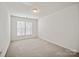 Well-lit empty bedroom with neutral carpet and bright window at 140 N Arcadian Way, Mooresville, NC 28117