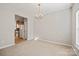 Bright dining area with pendant lighting has view to kitchen and adjacent living area at 140 N Arcadian Way, Mooresville, NC 28117