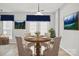 Cozy dining area with wood table and chairs is illuminated by a charming pendant light fixture at 140 N Arcadian Way, Mooresville, NC 28117