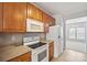 Cozy kitchen with wooden cabinets, updated appliances and modern countertops at 140 N Arcadian Way, Mooresville, NC 28117