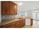 Kitchen with stainless steel appliances, countertop, and view into adjacent living and dining rooms at 140 N Arcadian Way, Mooresville, NC 28117