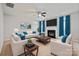 Bright living room boasts a fireplace, ceiling fan, and comfortable seating at 140 N Arcadian Way, Mooresville, NC 28117