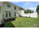 Back yard featuring a lush lawn, back patio, and mature landscaping at 140 N Arcadian Way, Mooresville, NC 28117